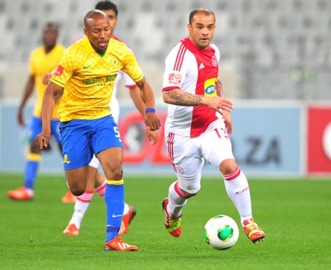 Lance Davids passes Katlego Mashego in the colours of Ajax Cape Town